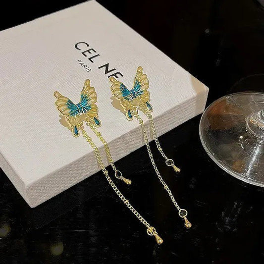Teal butterfly chain tassel earrings by Aurex